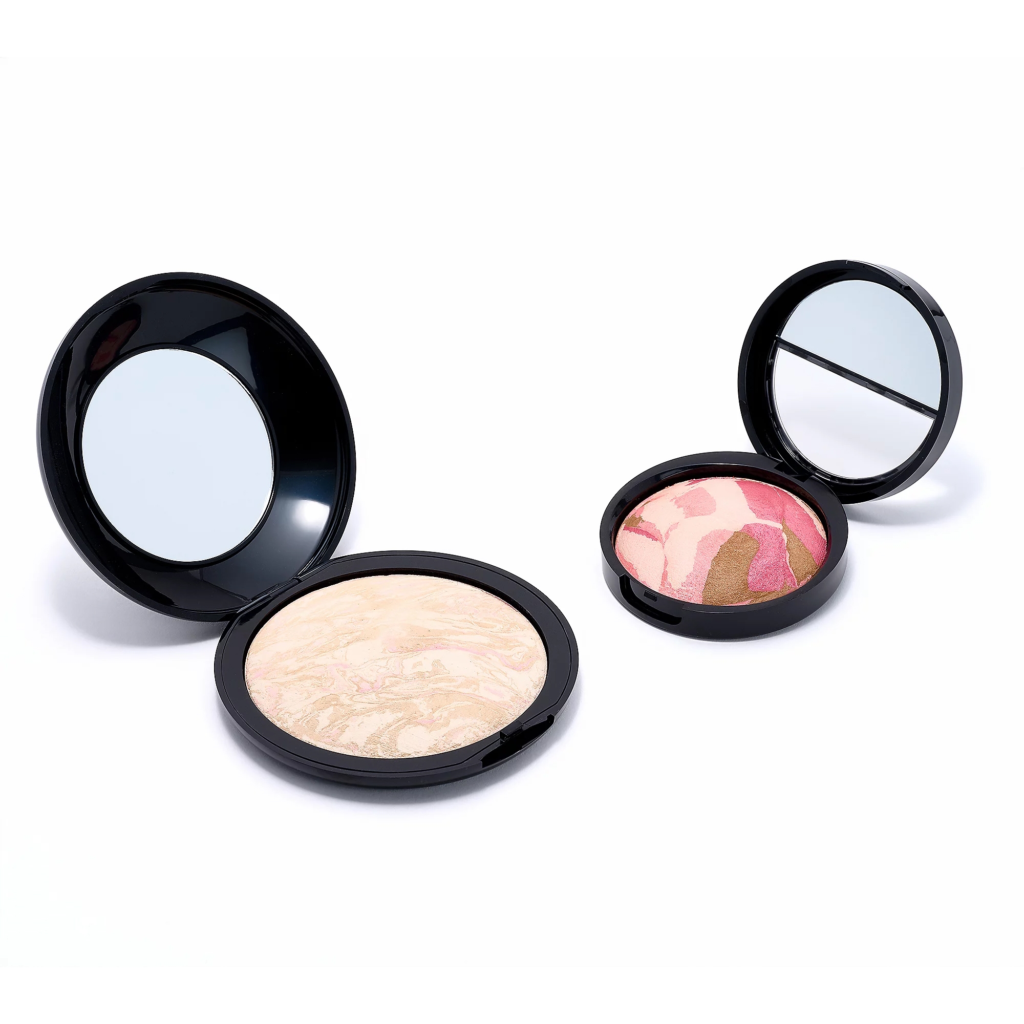 Laura Geller Super-Size Blush Set includes two open compacts with marbled powders. One features a soft, beige-toned powder, and the other has a pink and bronze swirl. Both have built-in mirrors.