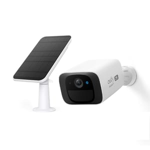 A white outdoor security camera with a black solar panel; both have a sleek modern design. The camera is labeled with \“eufy Security.\“
