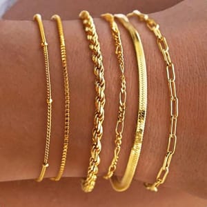 A set of five 14K gold bracelets, each with a unique chain design: two with sleek thin strings, one with a twisted rope style, one flat and textured, and one with elongated links. They are waterproof and designed to be worn stacked.