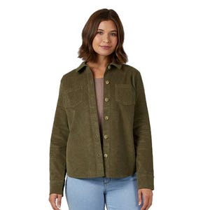 Olive green corduroy shirt jacket with a button front, two front pockets, and a collared design, worn with light blue jeans and a brown top.
