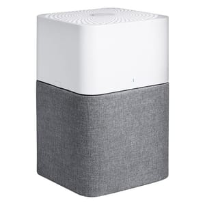A two-tone air purifier with a white top featuring a circular pattern and a gray fabric-covered bottom section.