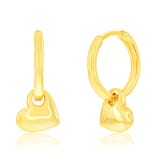 Gold hoop earrings with dangling heart charms.