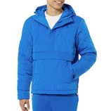 A person is wearing a bright blue quilted jacket with hood, featuring an overlapping front and a large pocket at the waist. The jacket is paired with matching blue pants.