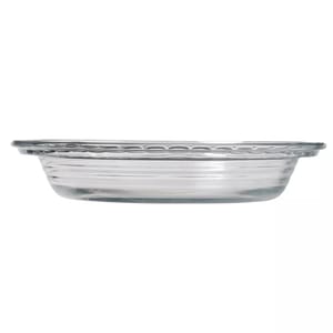Clear glass pie dish with a decorated rim and horizontally ribbed sides.