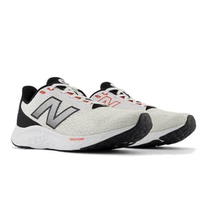 A pair of New Balance running shoes with a white and black mesh upper, red accents, and Fresh Foam soles designed for comfort and support.