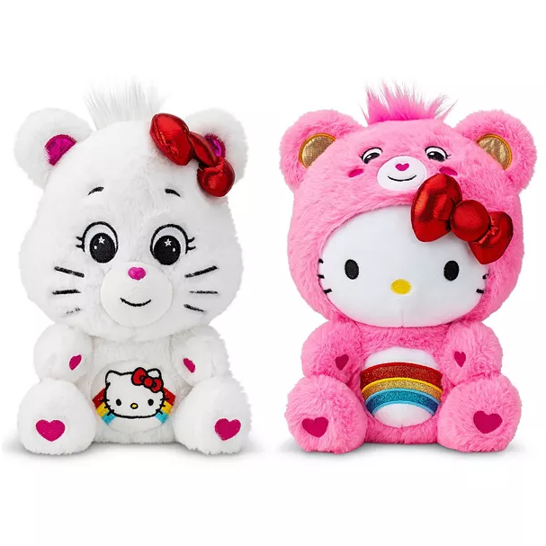 Two plush toys are shown: a white bear with a Hello Kitty emblem and a red bow, and a pink bear with a costume featuring Hello Kitty, a red bow, and a rainbow on the belly.