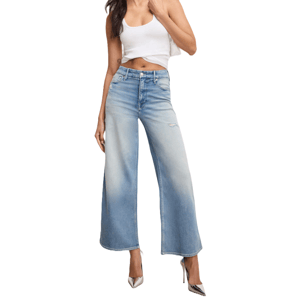 A person is wearing high-waisted, wide-leg jeans in a light blue wash, accompanied by a white crop tank top and silver high-heeled shoes.