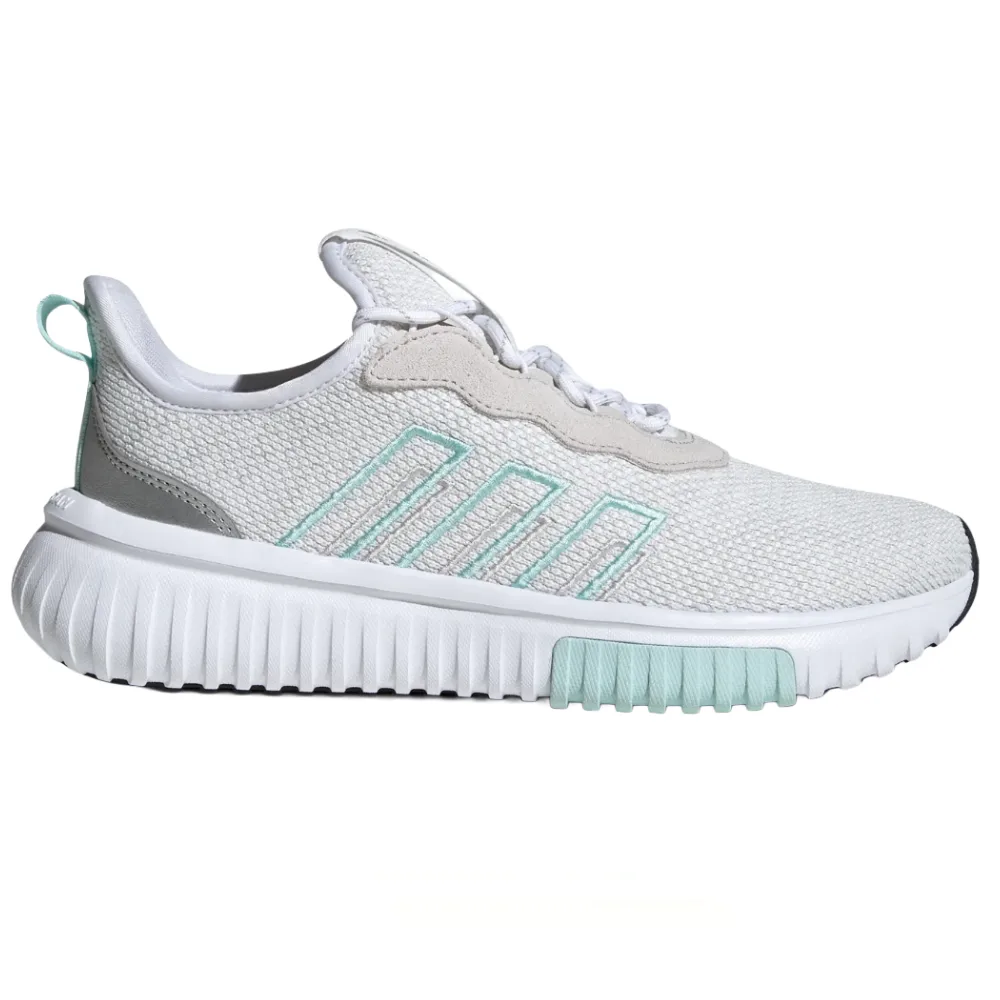 A white and light grey athletic sneaker with light teal accents, featuring a mesh upper, distinctive wavy paneling, and a textured sole.