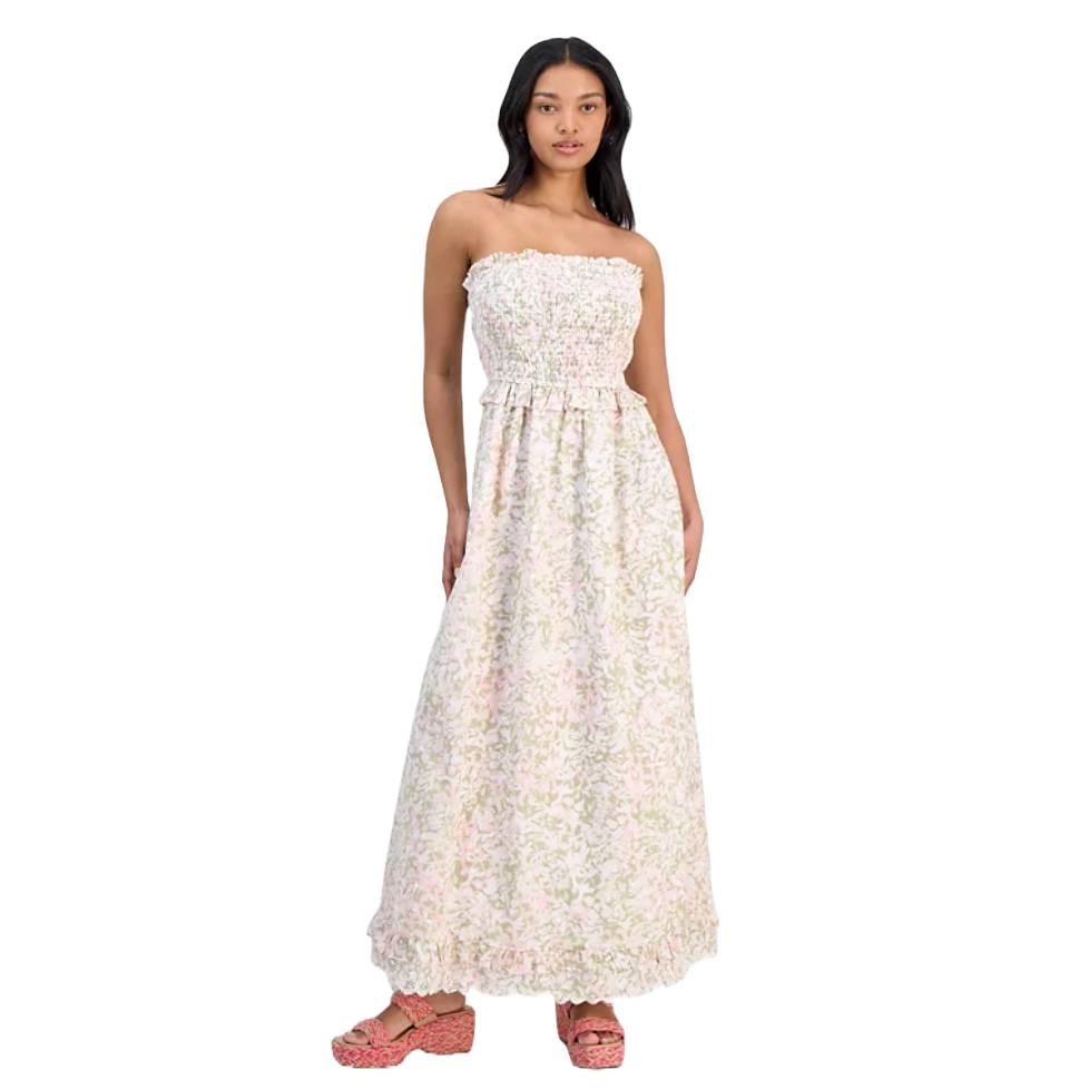 Strapless maxi dress with a smocked bodice and floral print, paired with pink textured sandals.