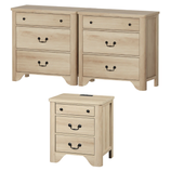 Two wooden dressers with three drawers each, featuring black handles, alongside a matching smaller nightstand with three drawers.