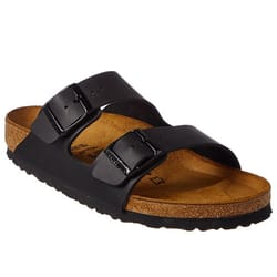 A black sandal with two adjustable straps and a cork footbed, designed for comfortable wear.