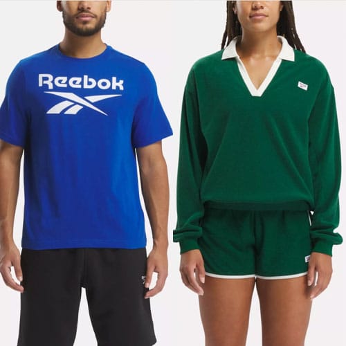 A man in a blue Reebok t-shirt and a woman in a green collared sweater with matching shorts.