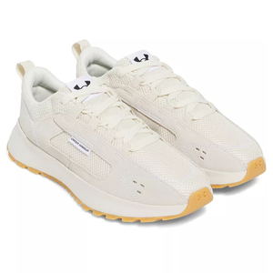Under Armour sneakers with a beige textile upper, lace-up design, and gum-colored outsole.