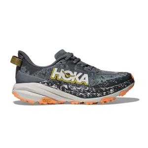 A Hoka trail running shoe with a grey, black, and orange color scheme, featuring a Vibram outsole for traction.