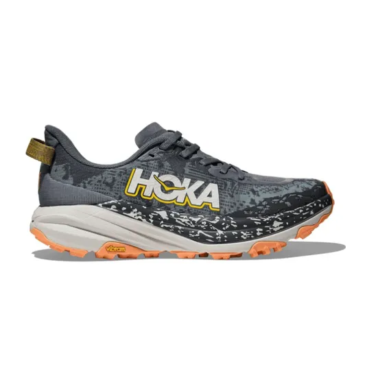 A Hoka trail running shoe with a grey, black, and orange color scheme, featuring a Vibram outsole for traction.