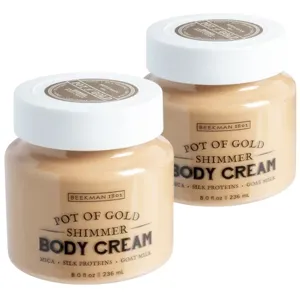 Two jars of Beekman 1802 Pot of Gold Shimmer Body Cream, featuring mica, silk proteins, and goat milk, each with a capacity of 8.0 fl oz (236 ml).