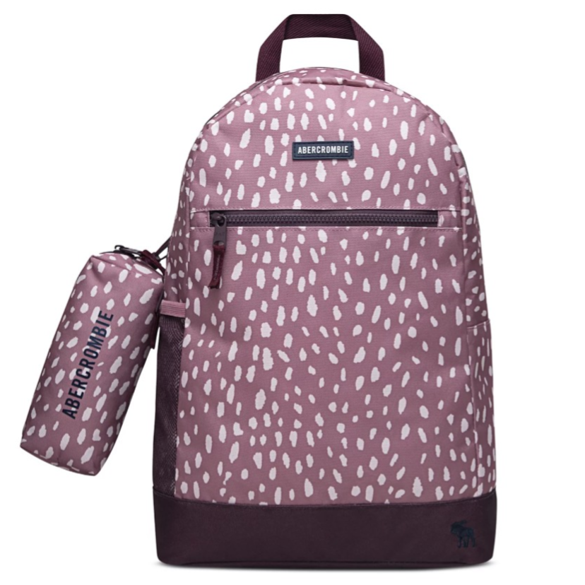 A pink Abercrombie backpack with a white dotted pattern and a matching cylindrical pouch attached to the side.