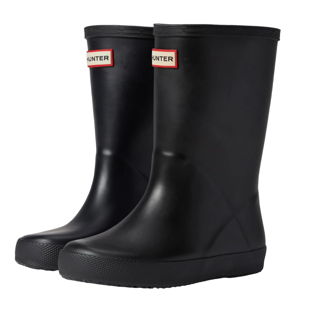 A pair of black rubber Hunter boots with a textured sole and a logo on the front.