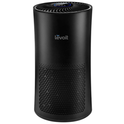 A Levoit air purifier featuring a sleek black cylindrical design with a vented front for air filtration and a control panel on top.