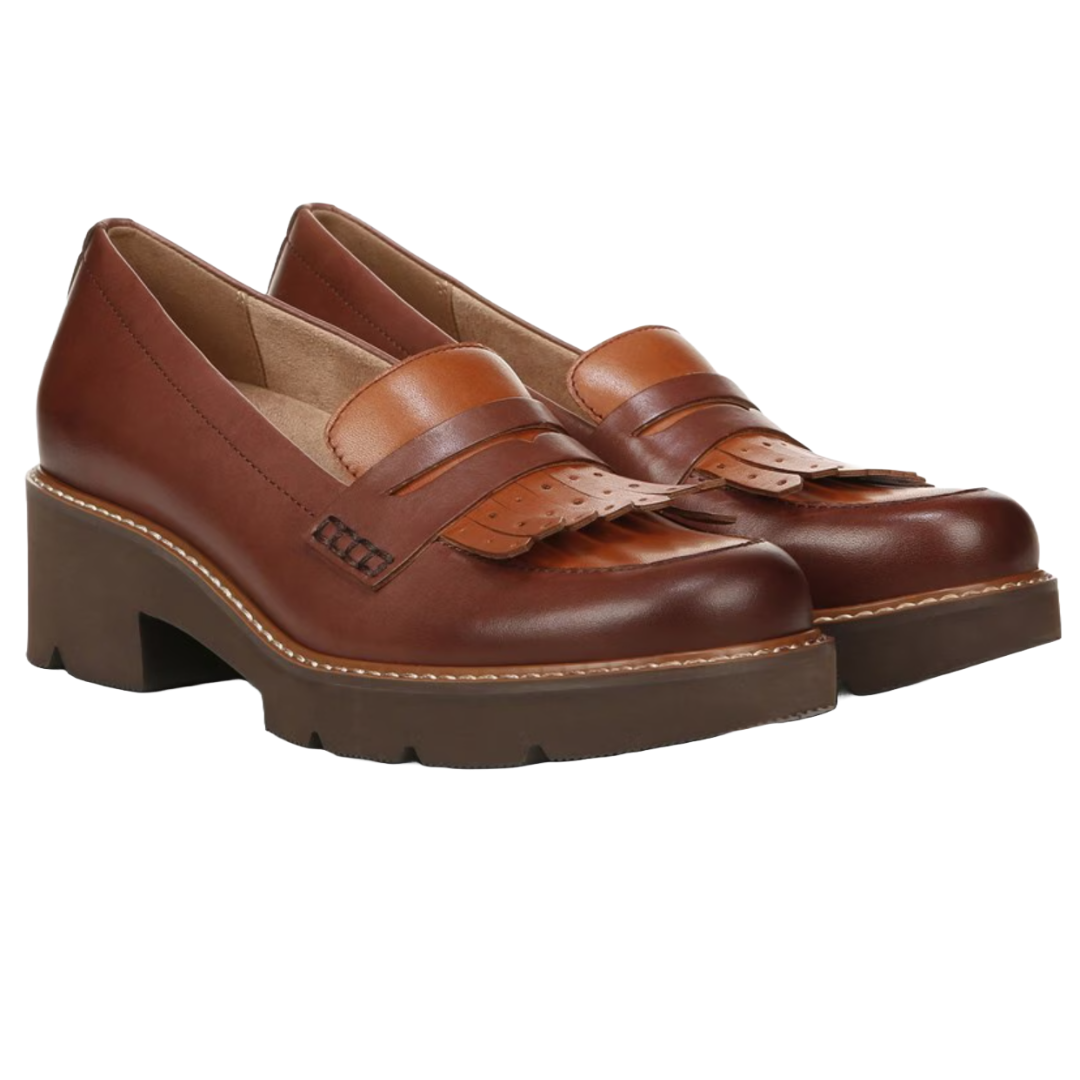 Brown leather platform loafers with a decorative fringe and stitching detail, featuring a chunky heel and slip-on design.