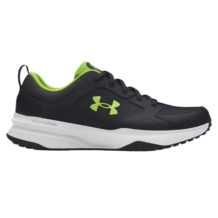 A black and neon green Under Armour sneaker with a white sole and \“Charged\“ cushioning, designed for athletic use.