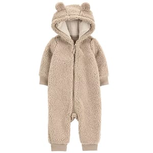 A beige, fluffy infant onesie with a hood and bear ears, featuring a front zipper and ribbed cuffs at the wrists and ankles.