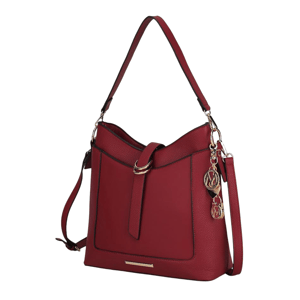 A stylish red handbag with a textured surface, featuring a top handle, adjustable shoulder strap, and gold-tone hardware with decorative charms.