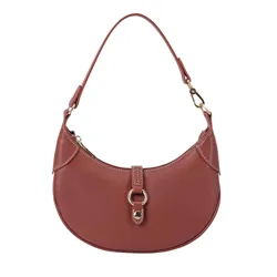 A brown leather handbag with a crescent shape, featuring gold hardware, a top handle, and a central buckle clasp.