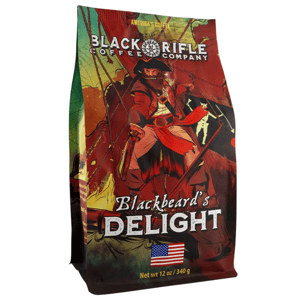 Blackbeard's Delight is a coffee roast by Black Rifle Coffee Company, featuring a bold design with a pirate theme. The packaging displays \“America's Coffee\“ and weighs 12 oz (340 g).