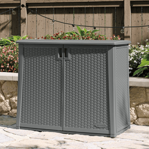 A gray resin outdoor storage cabinet with rattan pattern and a planter on top.