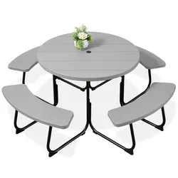 Round gray picnic table with three attached curved benches, supported by black steel legs; features a small bouquet in the center and a hole for an umbrella.