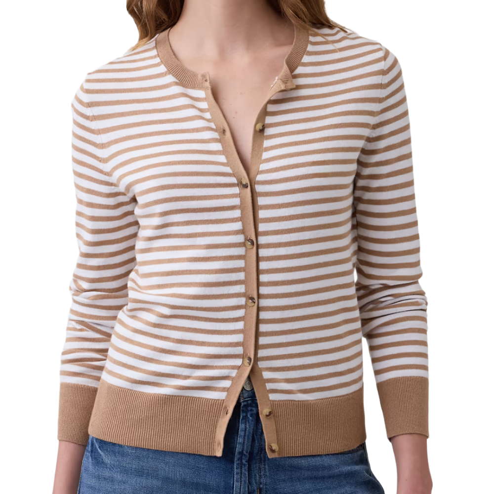 A striped cardigan with tan and white horizontal stripes, featuring a button-up front and ribbed accents at the cuffs and hem, paired with blue jeans.