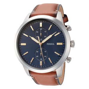 Fossil Townsman watch with a polished silver-tone stainless steel case, deep blue dial, gold-tone hands and markers, chronograph subdials, and a brown leather strap.