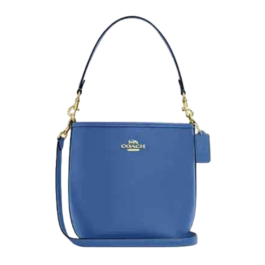 Blue Coach handbag with gold hardware, featuring a top handle and detachable shoulder strap.