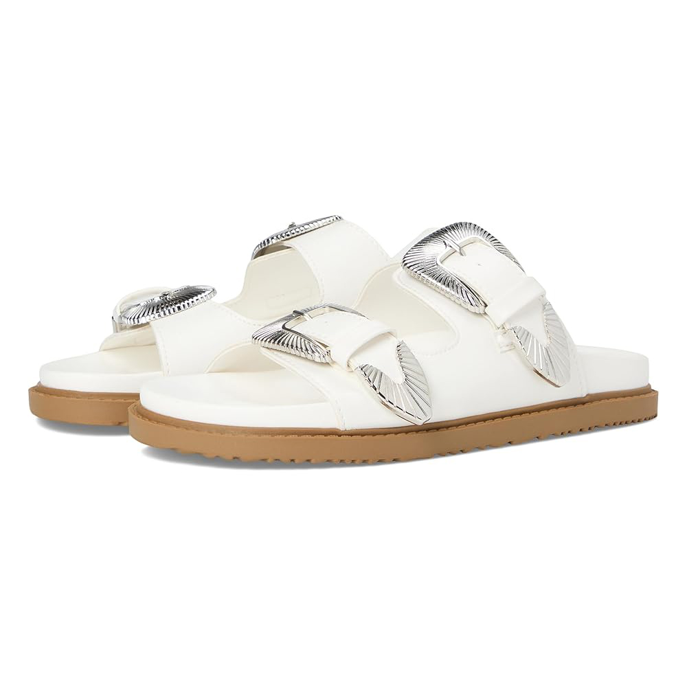 White sandals with two wide straps featuring large silver buckles, set on a brown sole.