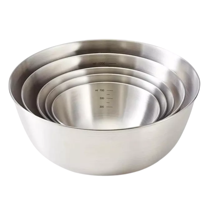 A set of four stainless steel mixing bowls, nesting inside each other, with measurement markings visible on the inside in milliliters.