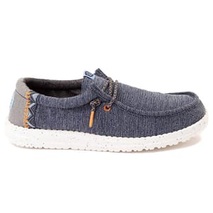 A casual slip-on shoe with a denim-like fabric, white speckled sole, and decorative laces. Ideal for relaxed, everyday wear.