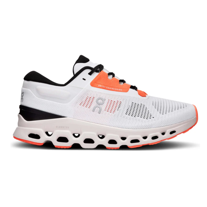 A white and orange athletic shoe with Swiss engineering features a breathable mesh upper and a cushioned sole with distinctive perforations for enhanced comfort and support.