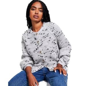 A speckled gray cardigan with a chunky knit texture, featuring raglan sleeves and large buttons. The cardigan is paired with blue jeans for a casual look.