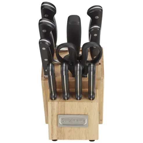 A knife block set with black-handled knives and a pair of kitchen scissors.