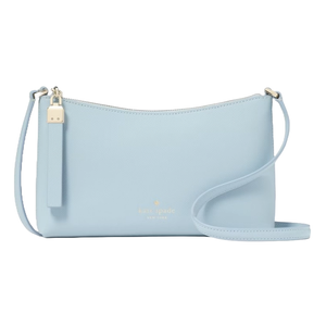 Light blue crossbody bag with a streamlined design, featuring a zip closure and an adjustable strap, embossed with \“kate spade new york.\“