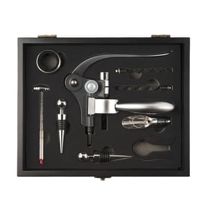 The 9-piece wine accessory set includes a lever-style corkscrew, foil cutter, bottle stopper, pourer, thermometer, drip ring, spare worm screw, and an additional stopper, all housed in a black gift box.
