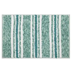A bath mat with a textured pattern featuring vertical stripes in shades of green, teal, and white.