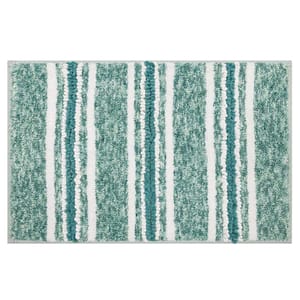A bath mat with a textured pattern featuring vertical stripes in shades of green, teal, and white.