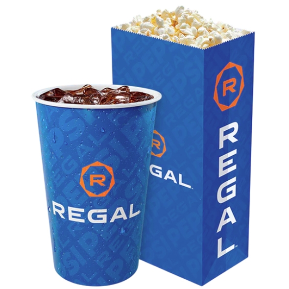 A blue cup with ice and a dark beverage next to a blue popcorn box, both labeled with the Regal logo.