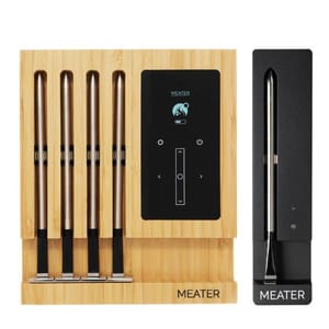 The Meater Meat Thermometer Bundle includes a bamboo charging block with four probes and an additional black single probe charger.