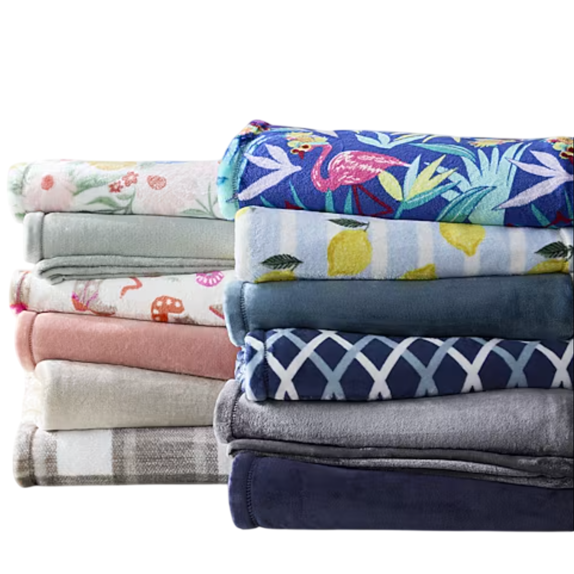 A variety of folded blankets in different colors and patterns, including floral, fruit, and geometric designs, stacked on a surface.