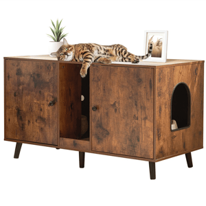 A wooden cabinet with a cat doorway is shown, featuring two doors and a shelf inside. A cat lies on top alongside a small potted plant and a framed photo.