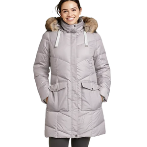 Eddie Bauer Lodge Cascadian Parka is a knee-length, light gray winter coat with a fur-trimmed hood, front flap pockets, and a quilted design for insulation.