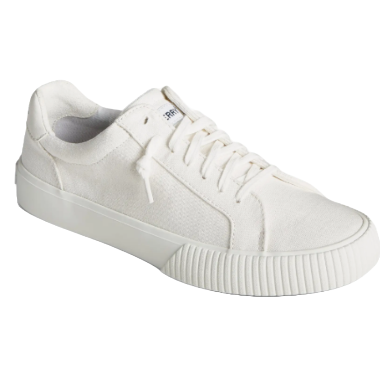 White low-top sneakers with a canvas upper, lace-up design, and a ribbed rubber sole.